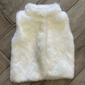 White furry vest